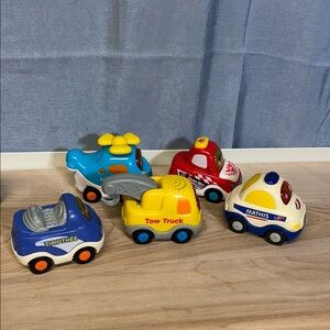 Lot of 5 VTech Go! Go! Smart Wheels Race Team and other truck french and English